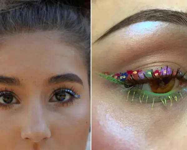 Ojo maquillaje hippie con flores y brillos. Delineado verde con pétalos de colores y pestañas inferiores neón.