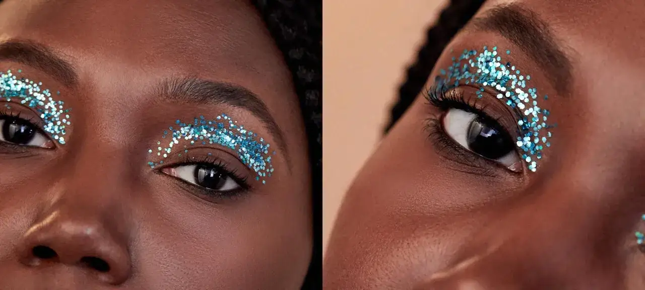 Maquillaje de ojos con brillos azules, creando un efecto de escarcha sobre la piel.